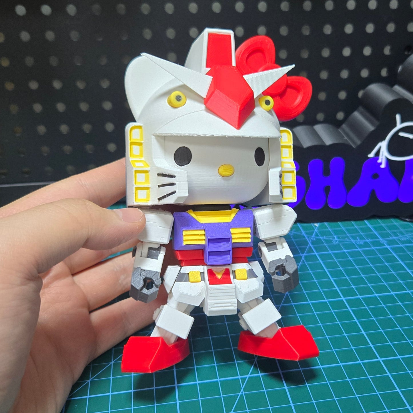 3D printed Hello Kitty Gundam desktop ornaments